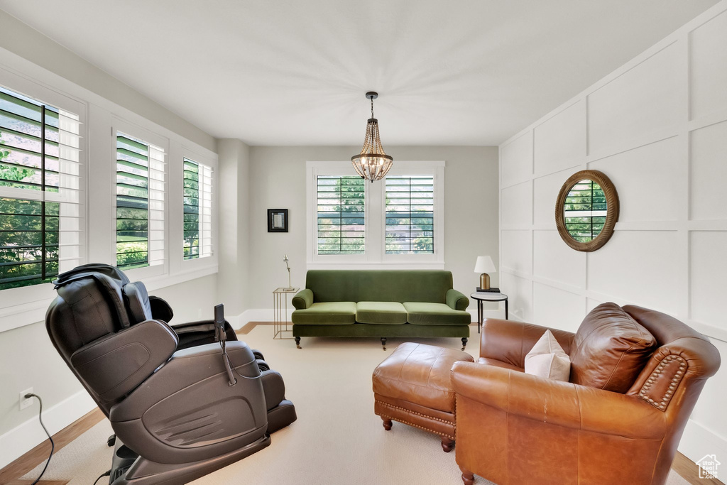 Living room with plenty of natural light and a chandelier