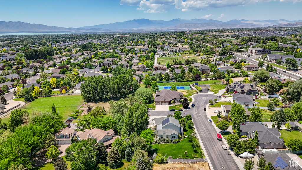 Aerial perspective of suburban area with a mountain backdrop