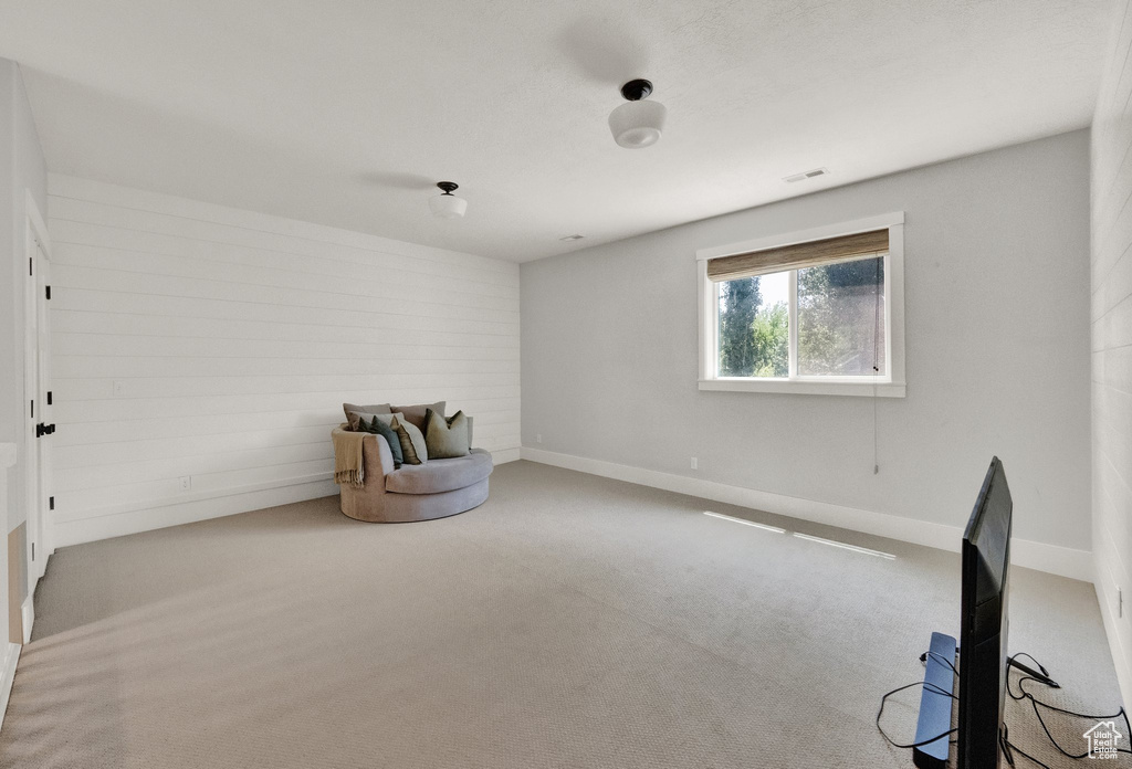 Unfurnished room featuring carpet floors and baseboards
