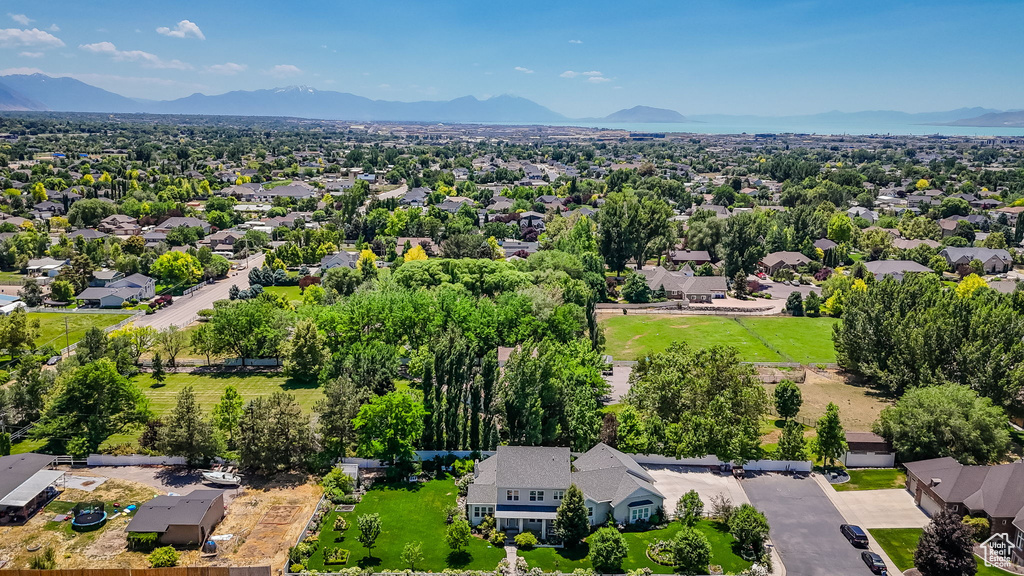 Aerial perspective of suburban area featuring a mountainous background