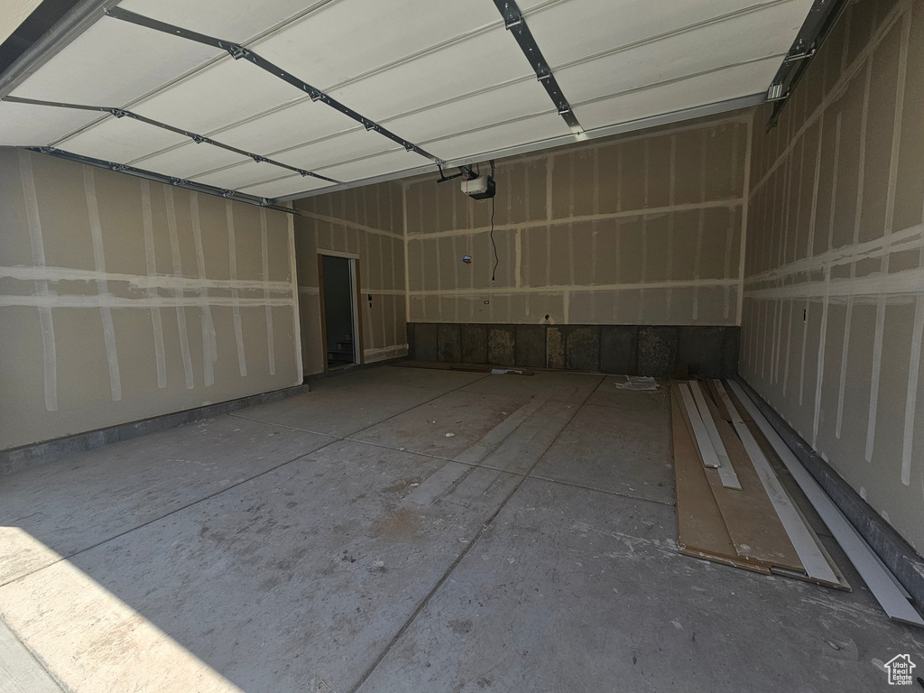 Garage featuring a garage door opener
