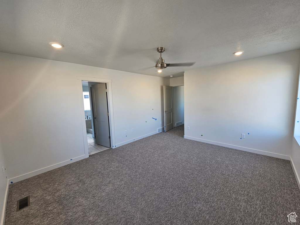 Unfurnished room featuring ceiling fan, carpet, a textured ceiling, and recessed lighting