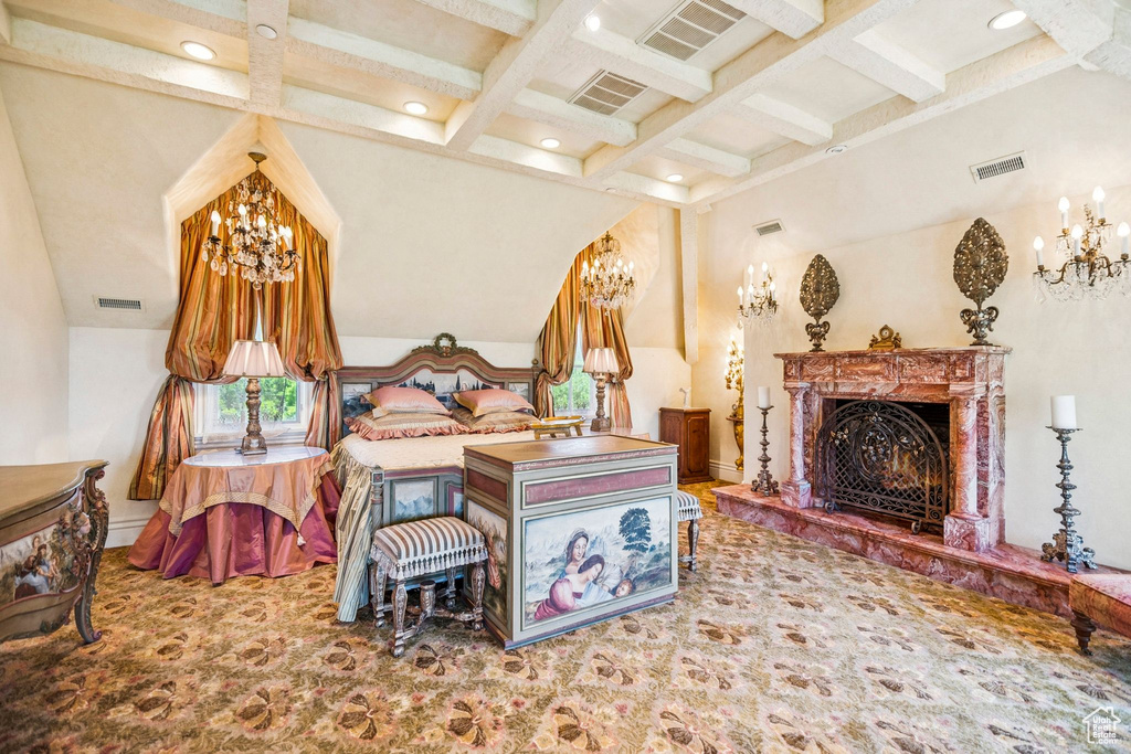 Bedroom with a chandelier, beamed ceiling, coffered ceiling, a premium fireplace, and recessed lighting