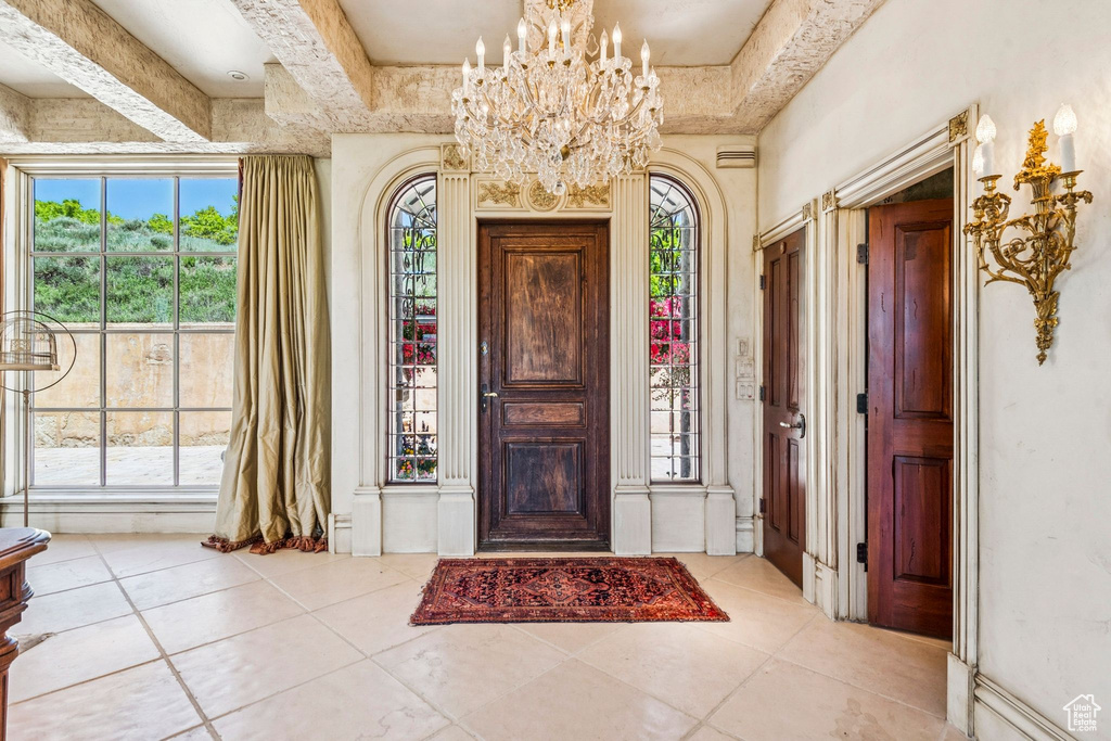 Entrance foyer with plenty of natural light and tile patterned flooring