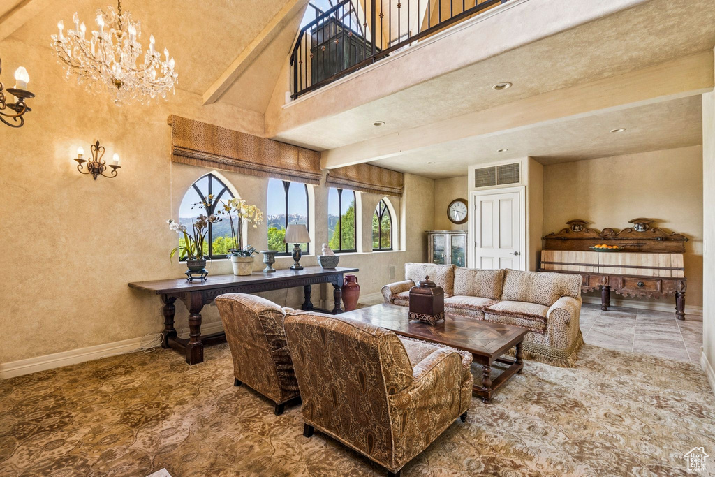 Living area with a chandelier and baseboards