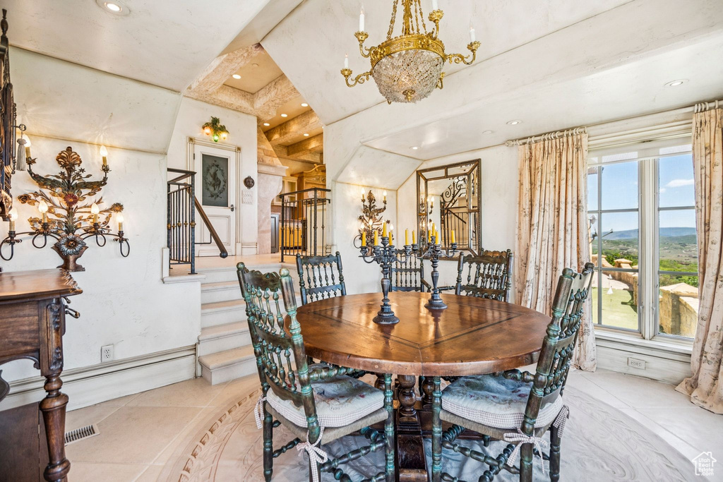 Dining area with a chandelier, stairs, light tile patterned floors, and recessed lighting