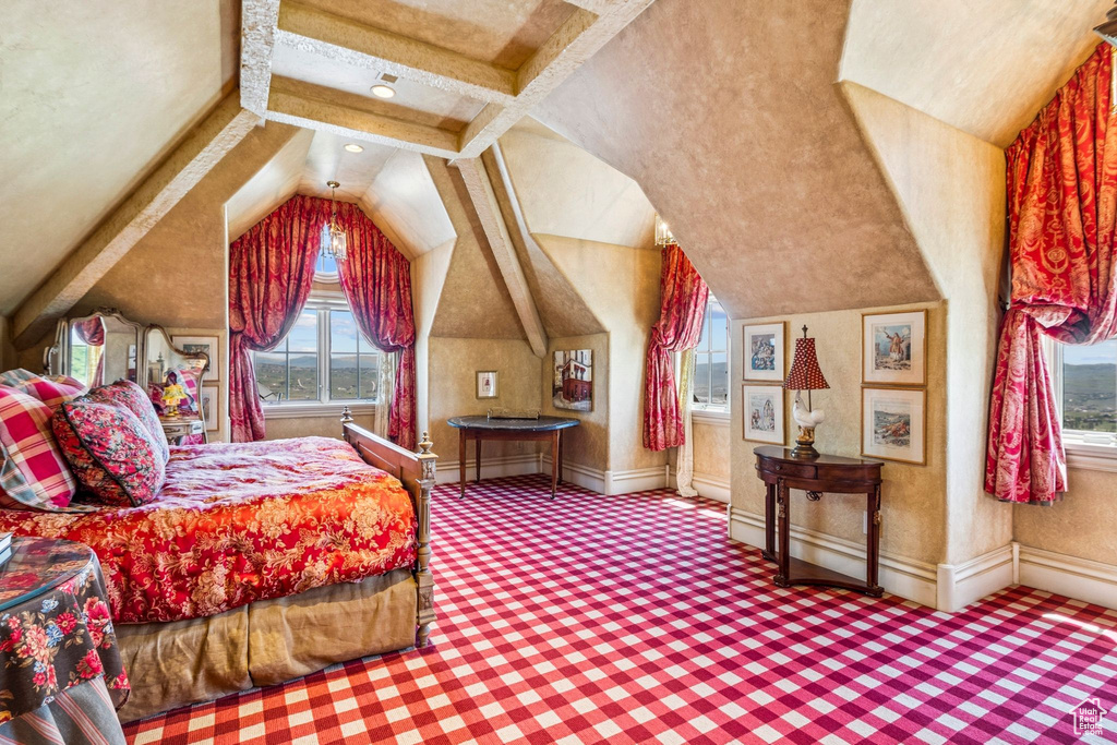 Carpeted bedroom with multiple windows