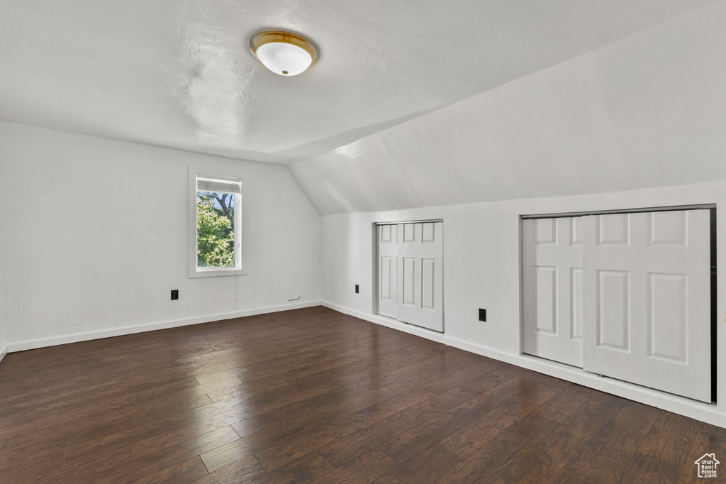 Bonus room featuring lofted ceiling and wood finished floors