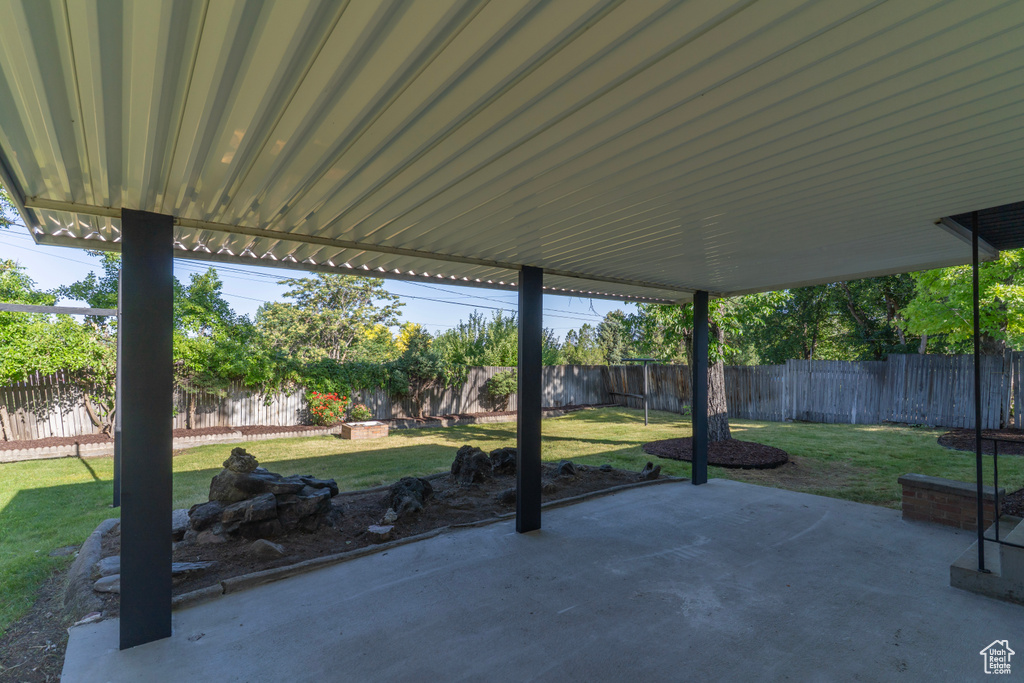Fenced backyard with a patio