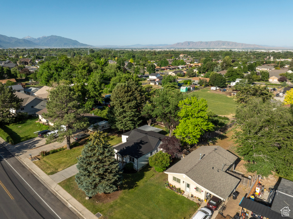 Aerial perspective of suburban area featuring a mountainous background