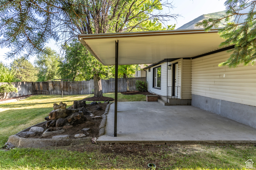Fenced backyard featuring a patio