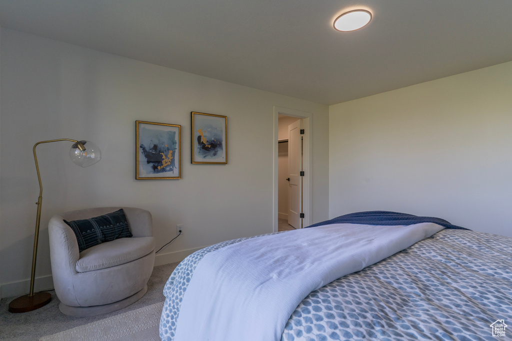Carpeted bedroom with baseboards