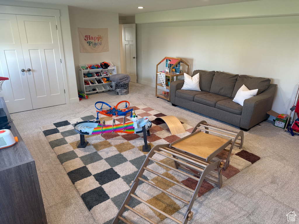 Living room with carpet floors and recessed lighting