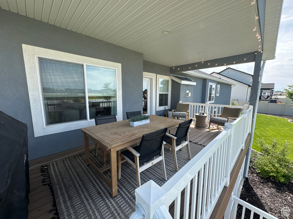 Wooden deck with outdoor dining space