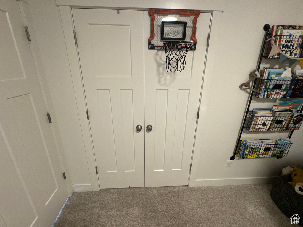 Detailed view of carpet floors and baseboards