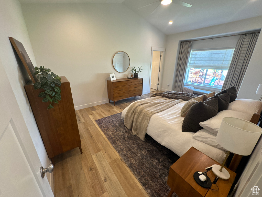 Bedroom with light wood-style floors, vaulted ceiling, a ceiling fan, and recessed lighting