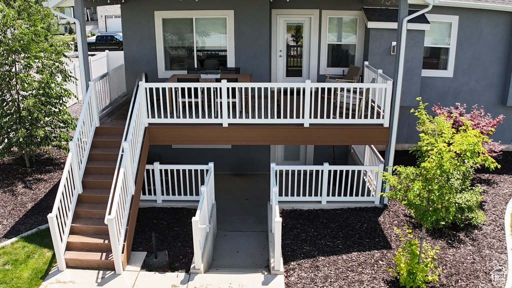 Property entrance featuring stucco siding