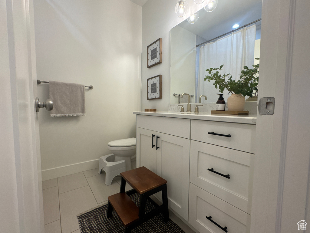 Bathroom featuring vanity and tile patterned flooring