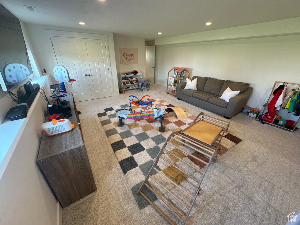 Living room featuring carpet and recessed lighting