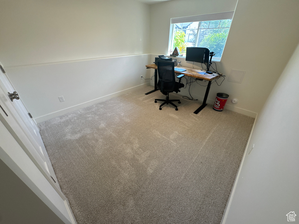 Carpeted office featuring baseboards
