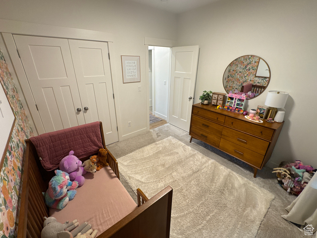 Bedroom with carpet floors and a closet