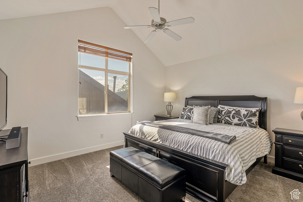 Bedroom with carpet floors, lofted ceiling, and ceiling fan