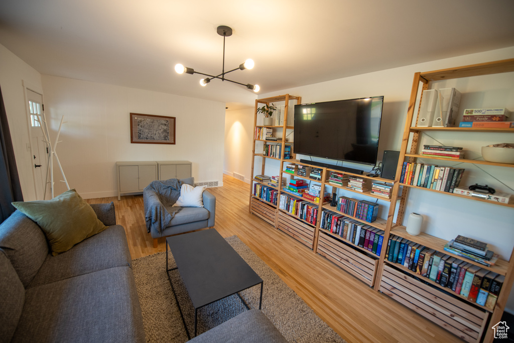 Living room with a chandelier and wood finished floors