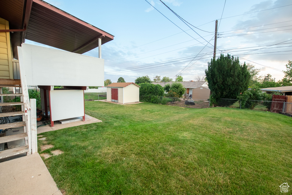 View of yard with a storage shed