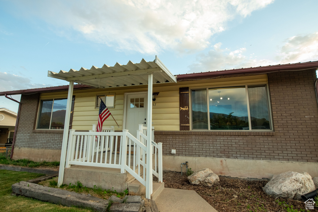 View of front facade featuring brick siding