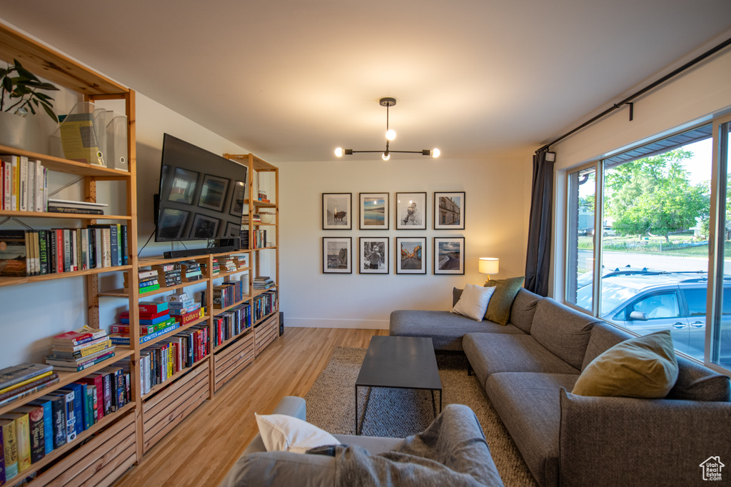 Living room featuring a chandelier and wood finished floors