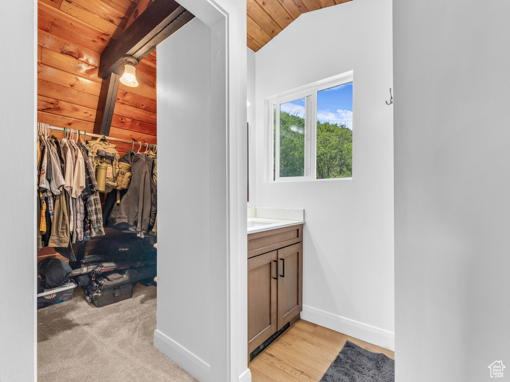 Bathroom with vanity, lofted ceiling, and wooden ceiling