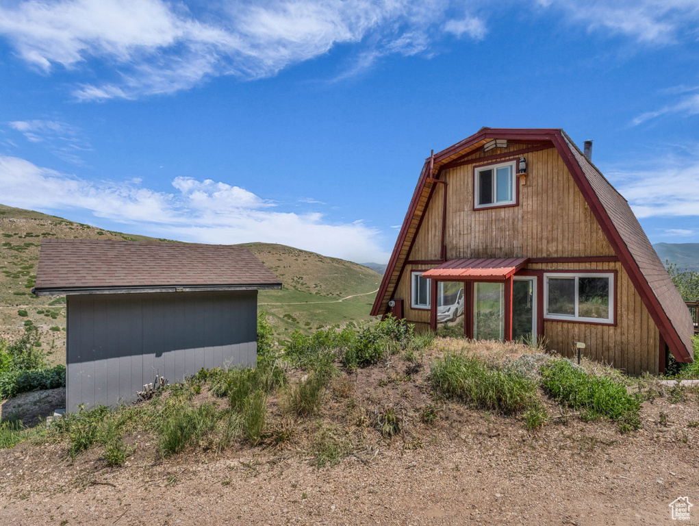 View of side of property featuring a mountain view