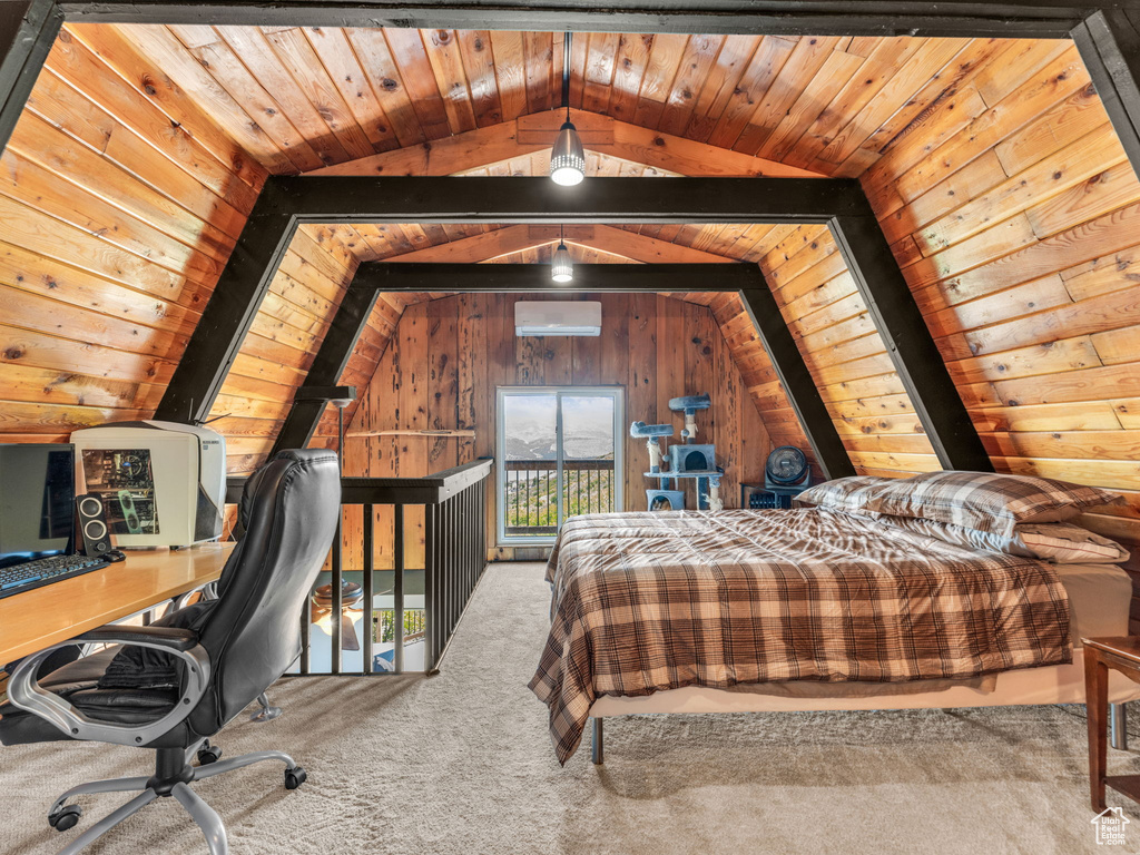 Carpeted bedroom with an AC wall unit, vaulted ceiling, an office area, and wood ceiling