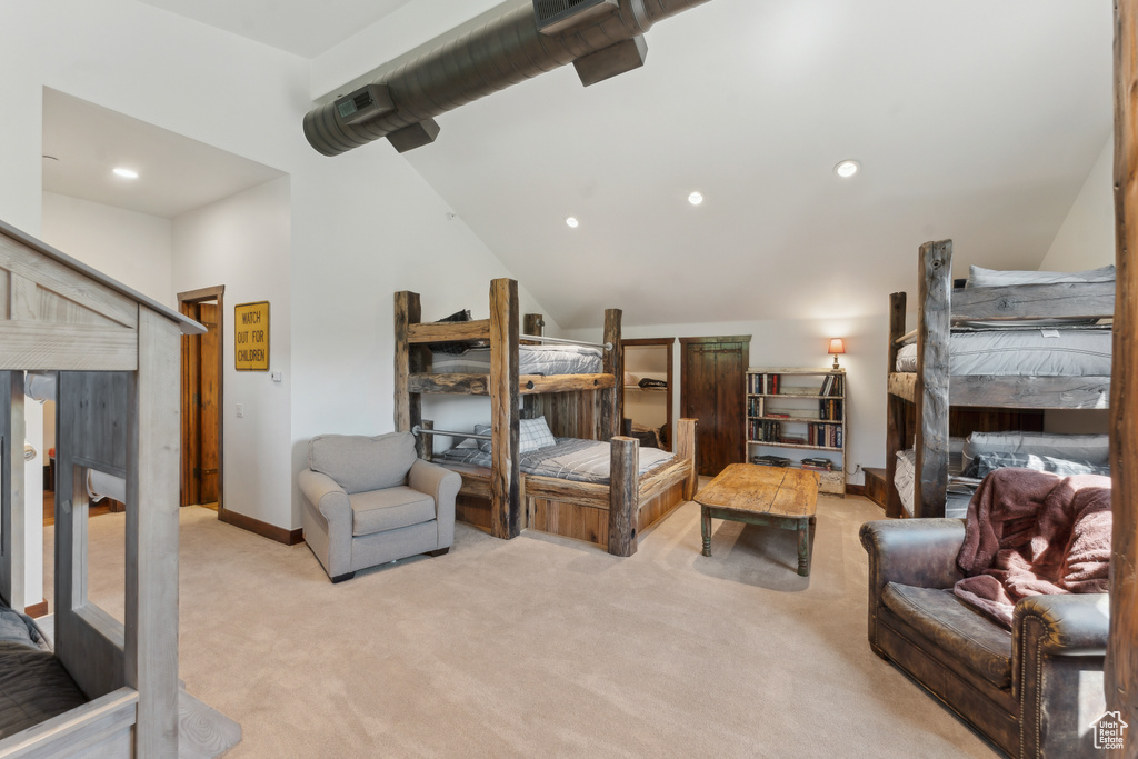 Bedroom featuring light carpet, lofted ceiling, and recessed lighting