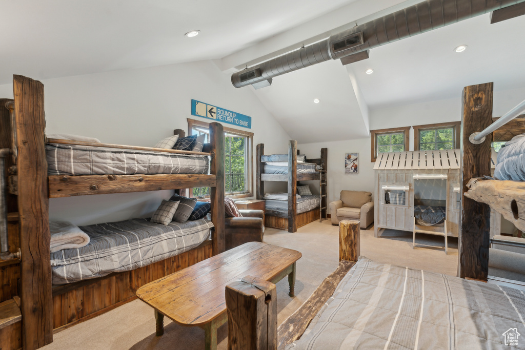 Bedroom featuring carpet flooring, multiple windows, and recessed lighting