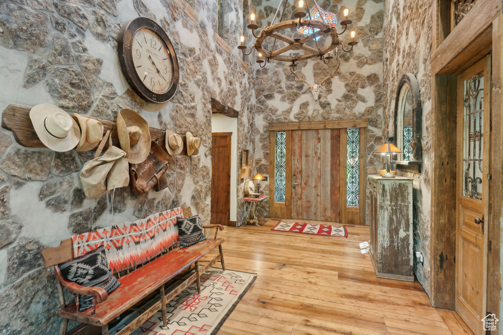 Foyer entrance featuring a chandelier and hardwood / wood-style floors
