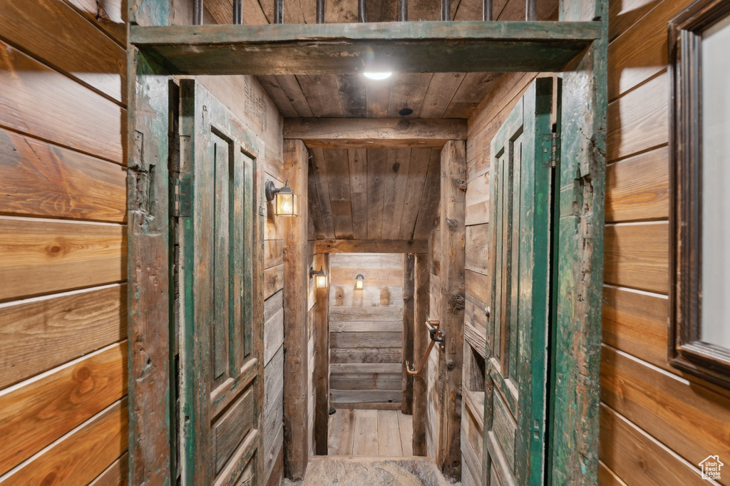 Interior space featuring wooden walls and wood ceiling