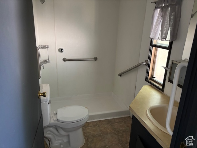 Bathroom with a stall shower and vanity