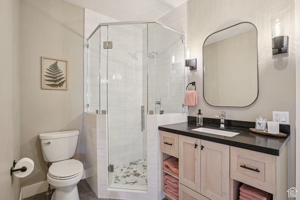 Full bath with vanity and a shower stall