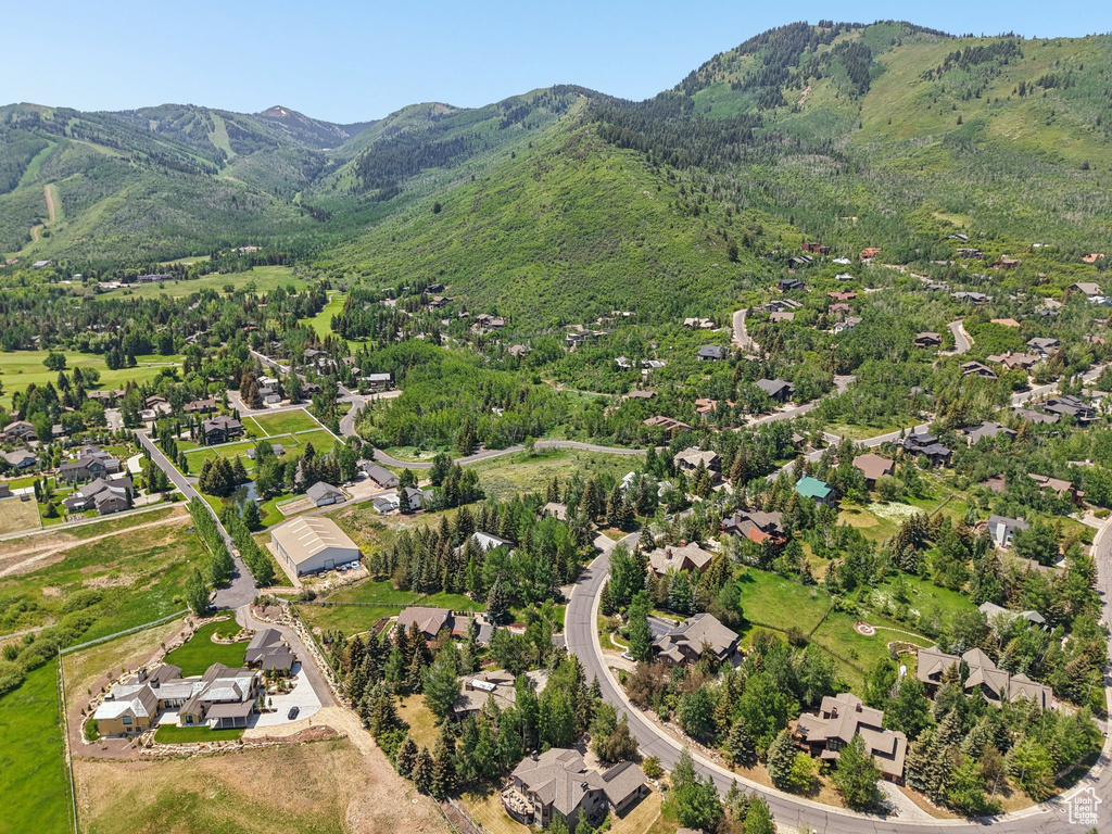 Aerial view of residential area featuring a mountain backdrop