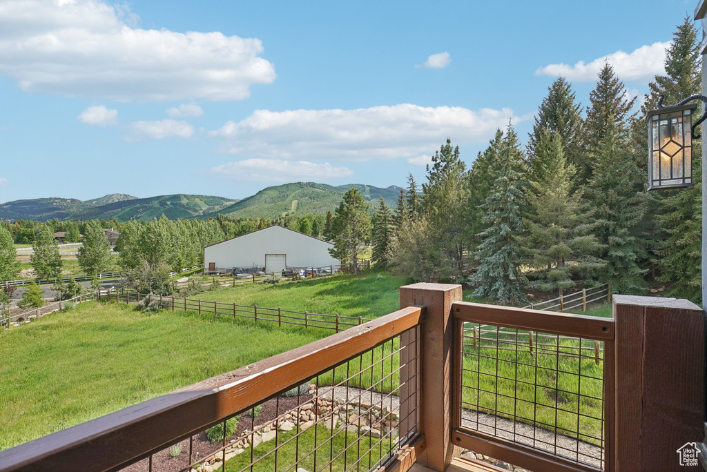 Wooden deck with a mountain view and a view of rural / pastoral area