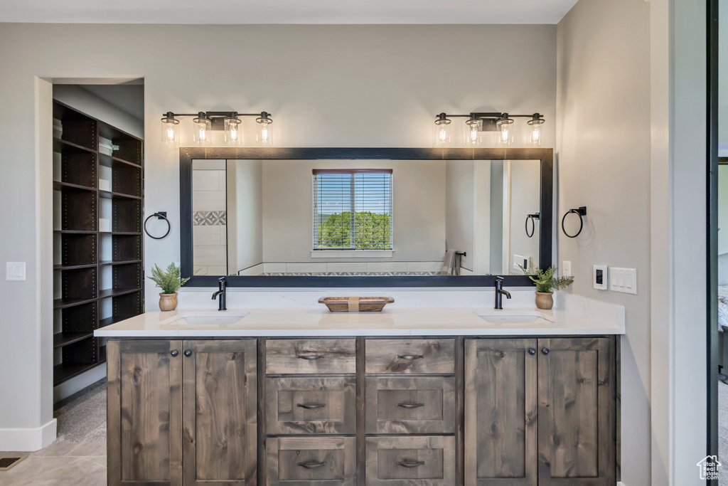Full bath featuring double vanity