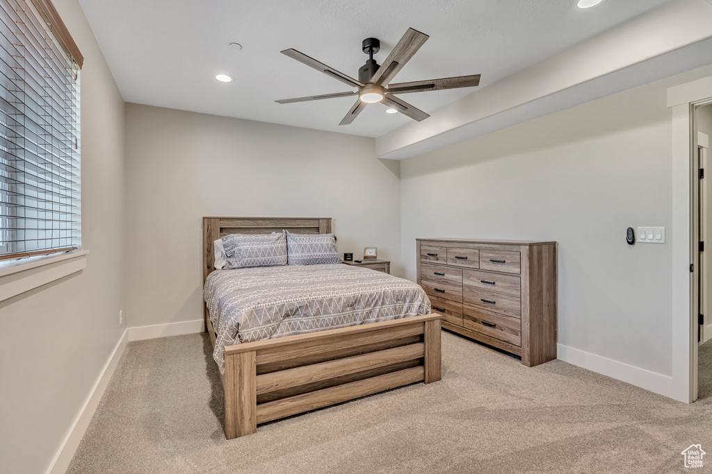 Bedroom featuring light colored carpet, recessed lighting, and a ceiling fan
