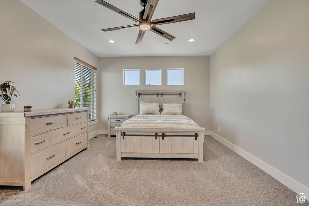 Bedroom featuring light colored carpet, recessed lighting, and ceiling fan