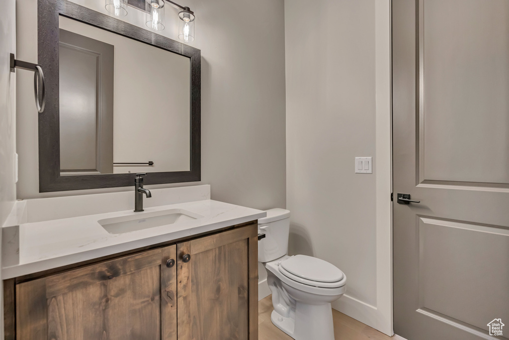 Bathroom with toilet and vanity