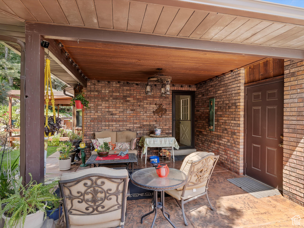 View of patio with an outdoor hangout area