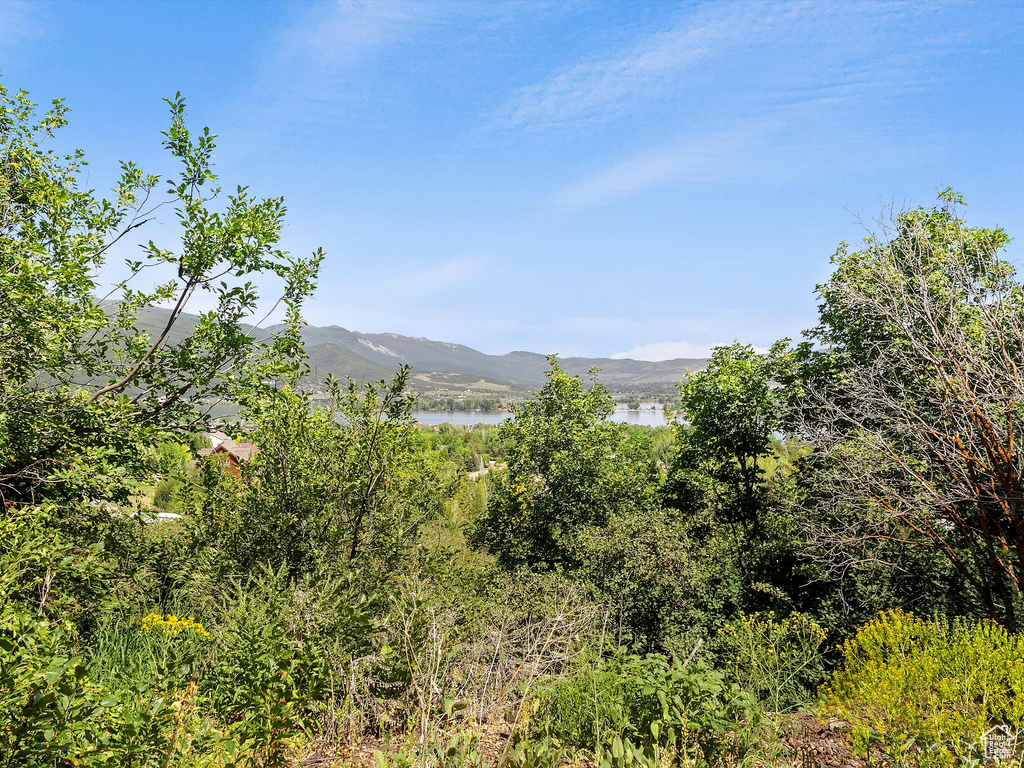 View of mountain backdrop featuring a nearby body of water