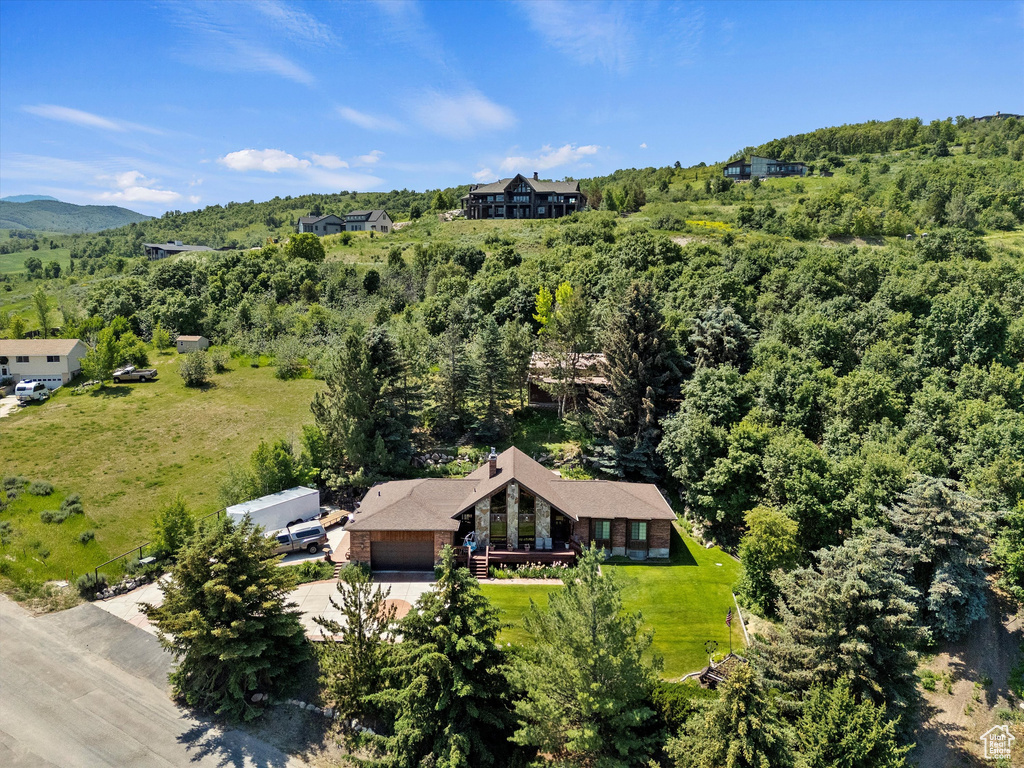 View of subject property featuring a heavily wooded area
