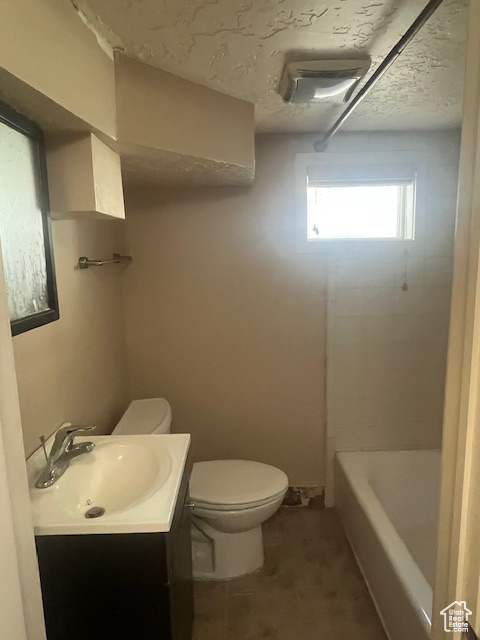 Full bath featuring toilet and vanity