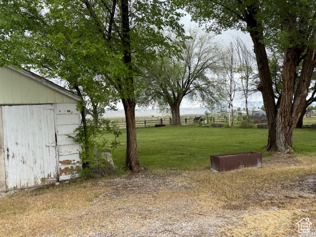 View of yard with an outdoor structure